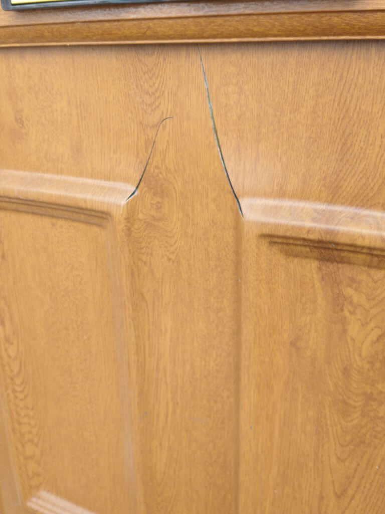 UPVC door panel with cracks in